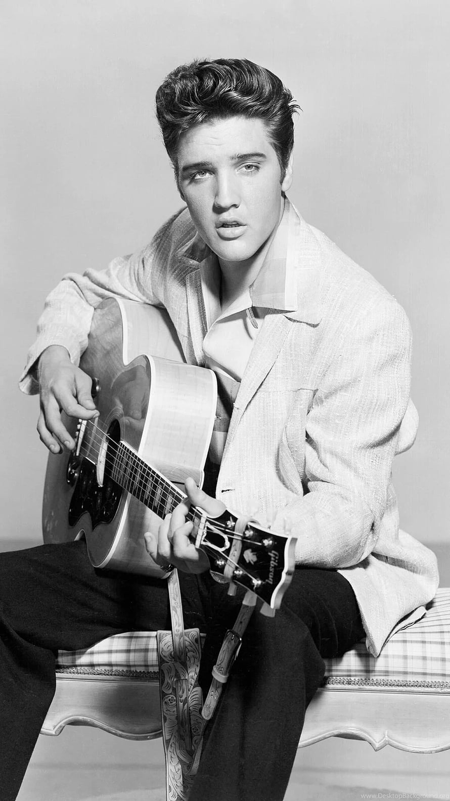 Elvis Presley seated with acoustic guitar in classic black and white portrait HD phone wallpaper