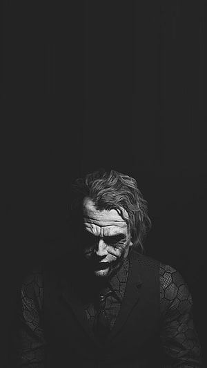 Joker Character Portrait in Dramatic Black and White Cinematic Style HD phone wallpaper
