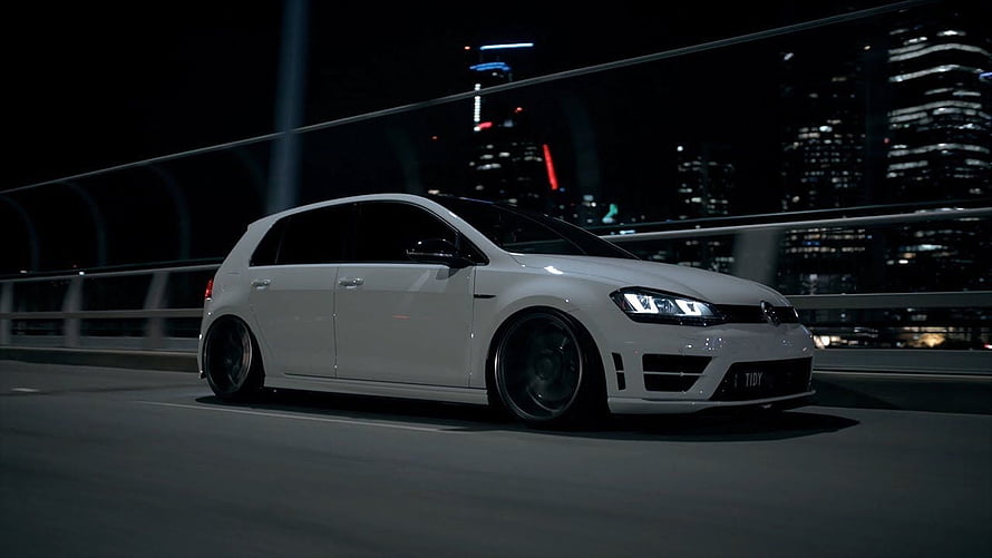 White Volkswagen Golf R MK7 Stance Build on a Night City Bridge HD wallpaper