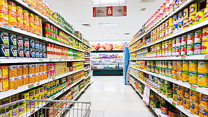 Bright Supermarket Aisle Packed With Canned Goods And Grocery Products HD wallpaper