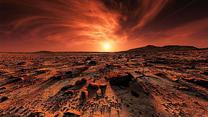 Mars Surface at Sunset with Rocky Terrain and Dramatic Red Sky HD wallpaper
