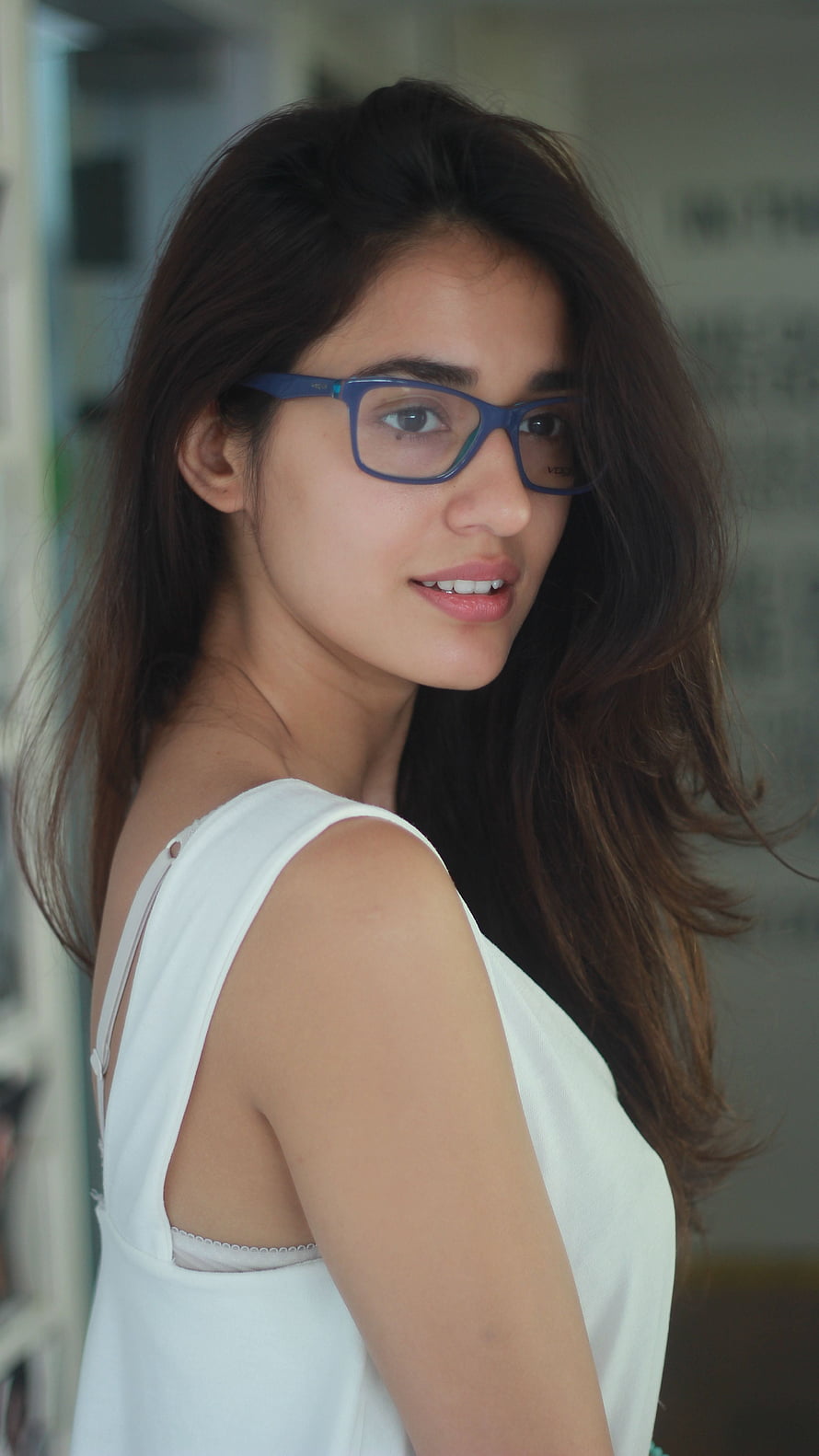 Disha Patani Portrait in White Sleeveless Top and Blue Eyeglasses HD phone wallpaper