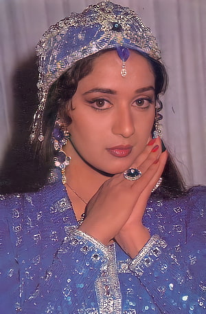 Madhuri Dixit in ornate blue traditional attire with intricate silver jewelry and headpiece HD phone wallpaper