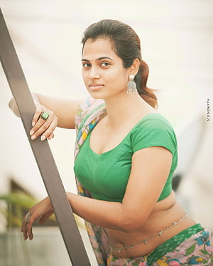 Ramya Pandian in Green Blouse and Floral Saree Leaning on Railing HD phone wallpaper