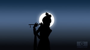 Silhouette of Lord Krishna Playing Flute Against a Full Moon HD wallpaper