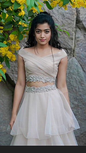 Rashmika Mandanna in a pastel pink and cream two-piece gown with floral accents HD phone wallpaper