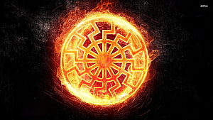Glowing Fiery Sun Symbol with Intricate Geometric Pattern on Dark Background HD wallpaper