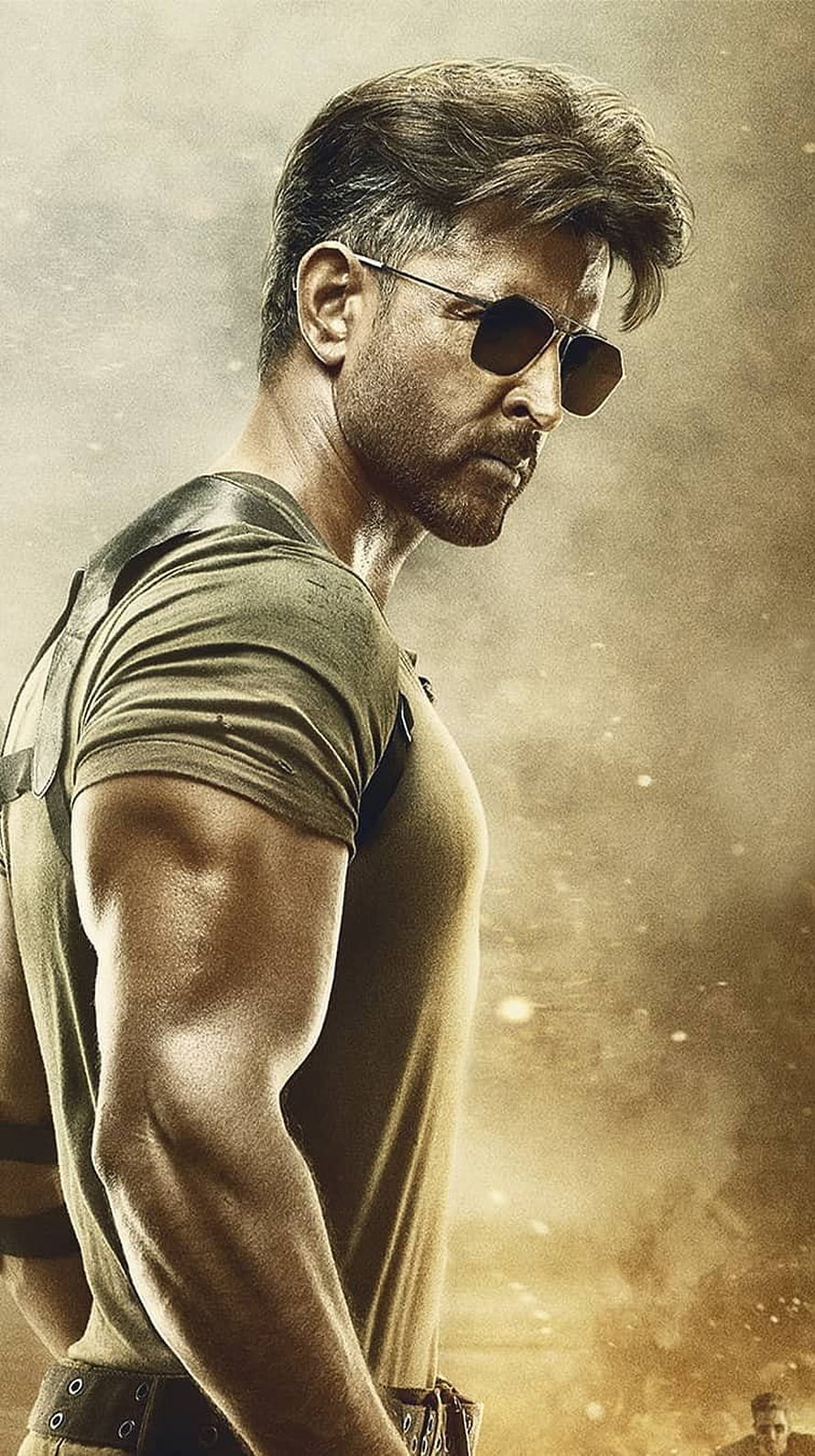 Hrithik Roshan in a gritty action pose wearing sunglasses and a tactical vest HD phone wallpaper