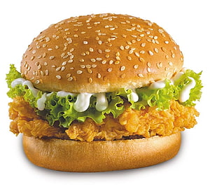 Crispy Zinger Chicken Burger with Sesame Bun, Lettuce, and Mayonnaise on White Background HD wallpaper