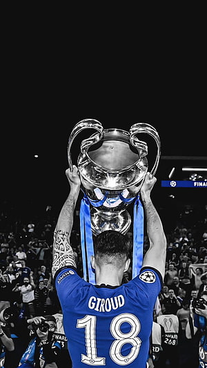 Olivier Giroud lifting the UEFA Champions League trophy in a Chelsea jersey HD phone wallpaper