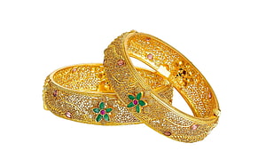 Intricate Gold Bangles with Floral Enamel and Gemstone Accents HD wallpaper