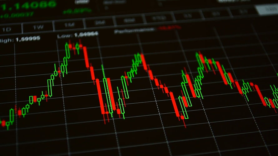 Candlestick Chart Displaying Stock Market Volatility and Price Trends on a Digital Trading Screen HD wallpaper