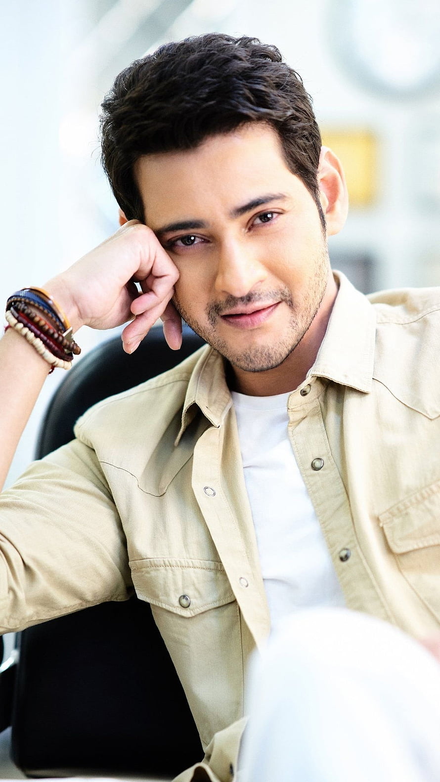 Mahesh Babu in a beige shirt with a relaxed pose and subtle smile HD phone wallpaper