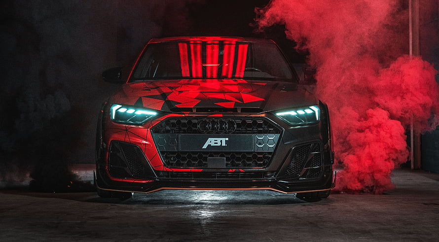 Audi A1 ABT Sportsline Front View with Red Smoke and Geometric Wrap HD wallpaper