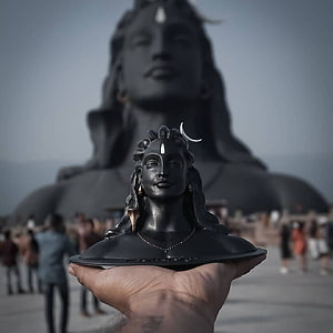 Adiyogi Shiva Bust Held in Hand with Massive Statue in Background HD phone wallpaper