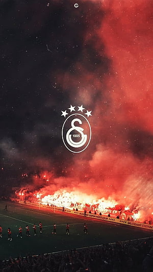 Galatasaray Stadium Flares and Team Crest at Night HD phone wallpaper