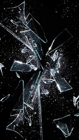 Shattered Glass Fragments Exploding Against a Dark Background HD phone wallpaper