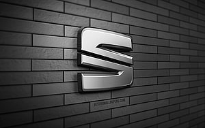 Seat Automotive Emblem Mounted on Dark Gray Brick Wall HD wallpaper