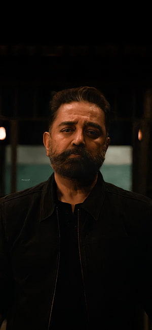 Kamal Haasan as Vikram in a dark cinematic portrait with a serious expression HD phone wallpaper