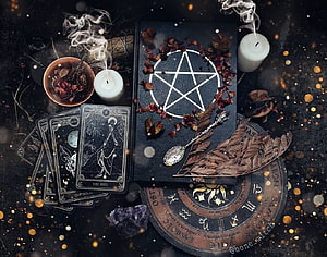 Dark Witchcraft Aesthetic Flat Lay with Tarot Cards, Pentagram Book, and Candles HD wallpaper