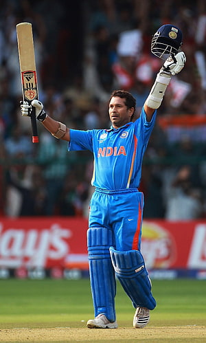 Sachin Tendulkar Celebrating in India Cricket Jersey with Bat and Helmet HD phone wallpaper