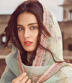 Iqra Aziz in Traditional Pakistani Attire with Embroidered Dupatta and Floral Jewelry HD phone wallpaper