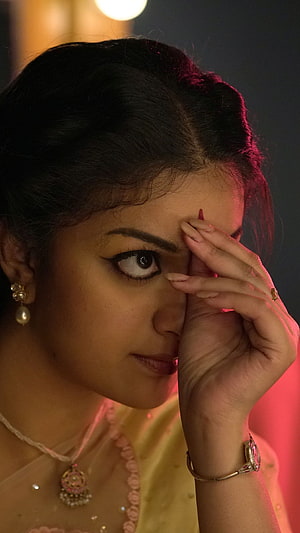 Keerthi Suresh in Mahanati: Dramatic Portrait with Traditional Indian Jewelry and Warm Cinematic Lighting HD phone wallpaper