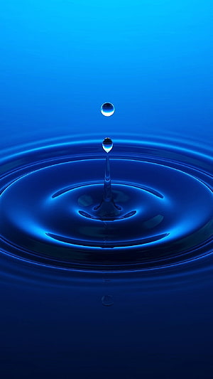 Vibrant Blue Water Droplet Splash with Expanding Ripples on a Smooth Surface HD phone wallpaper