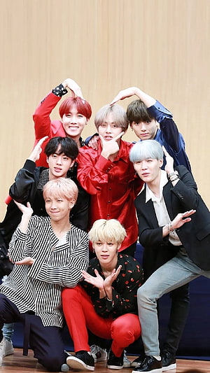BTS Members Posing Together in Colorful Stage Outfits HD phone wallpaper