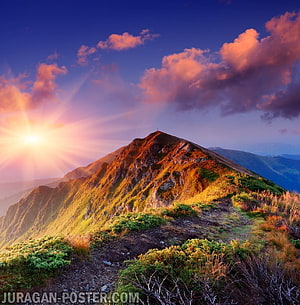 Sunrise over a rugged mountain ridge with dramatic pink clouds and golden light HD phone wallpaper
