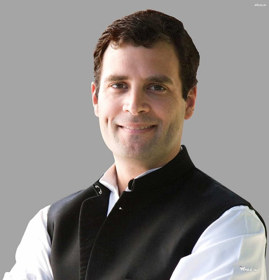 Rahul Gandhi in a black Nehru jacket and white shirt against a grey studio background HD phone wallpaper