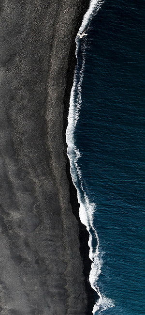 Aerial View of Black Sand Beach and Ocean Waves in Iceland HD phone wallpaper