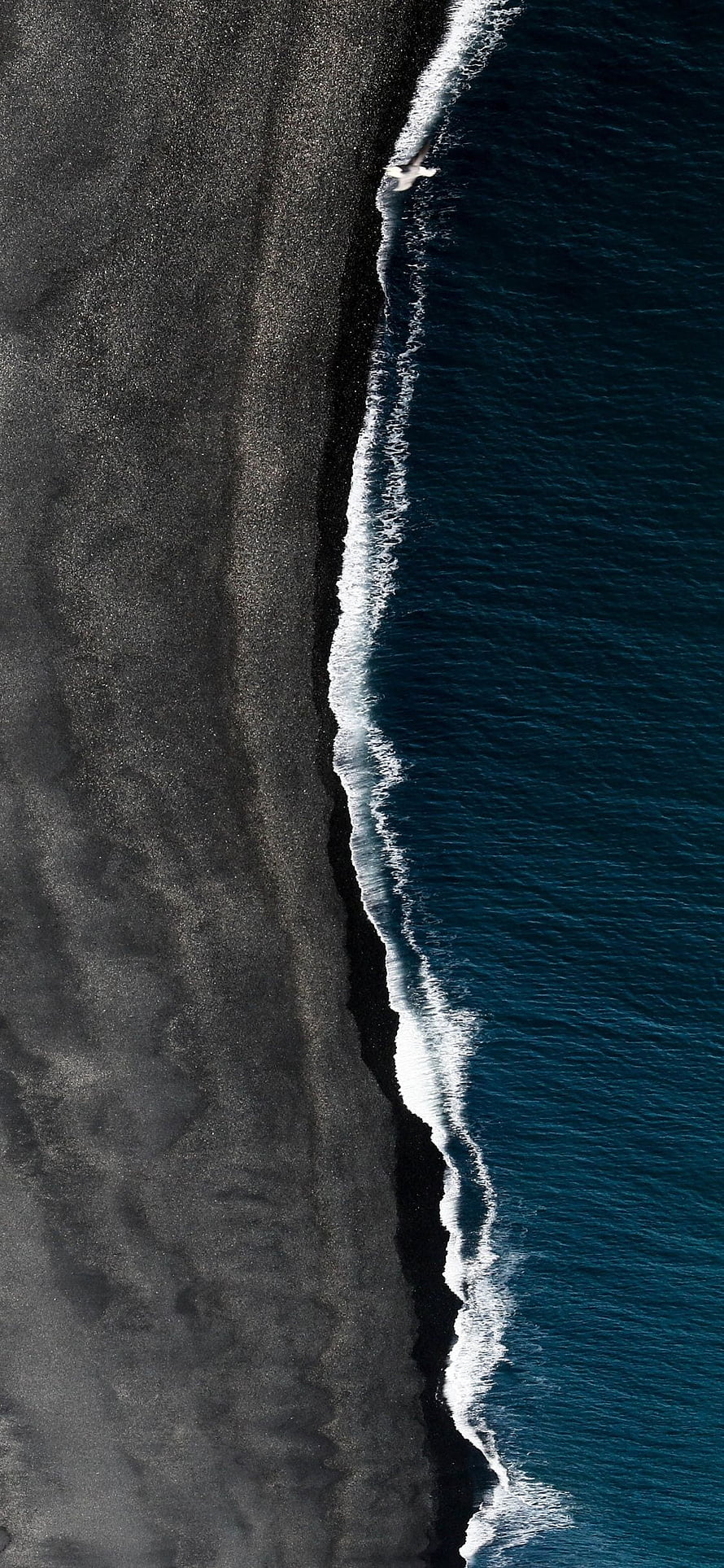 Aerial View of Black Sand Beach and Ocean Waves in Iceland HD phone wallpaper