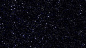 Deep Space Starfield with Scattered Blue and White Stars Against a Dark Cosmic Background HD wallpaper