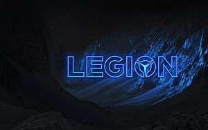Lenovo Legion glowing blue logo on dark rocky mountain landscape at night HD wallpaper