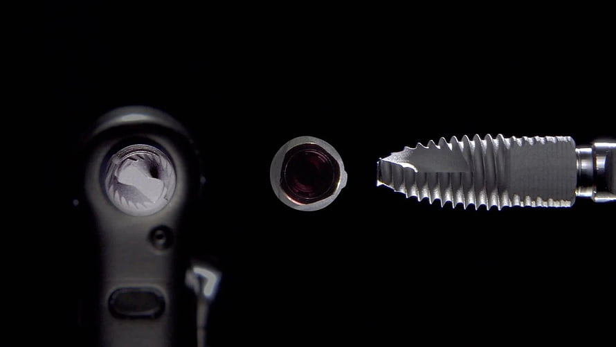 Close-up of dental implant components and surgical tools on a black background HD wallpaper