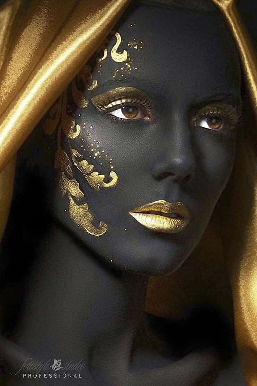 Elegant Black and Gold Face Art Portrait with Ornate Metallic Makeup and Silk Drape HD phone wallpaper