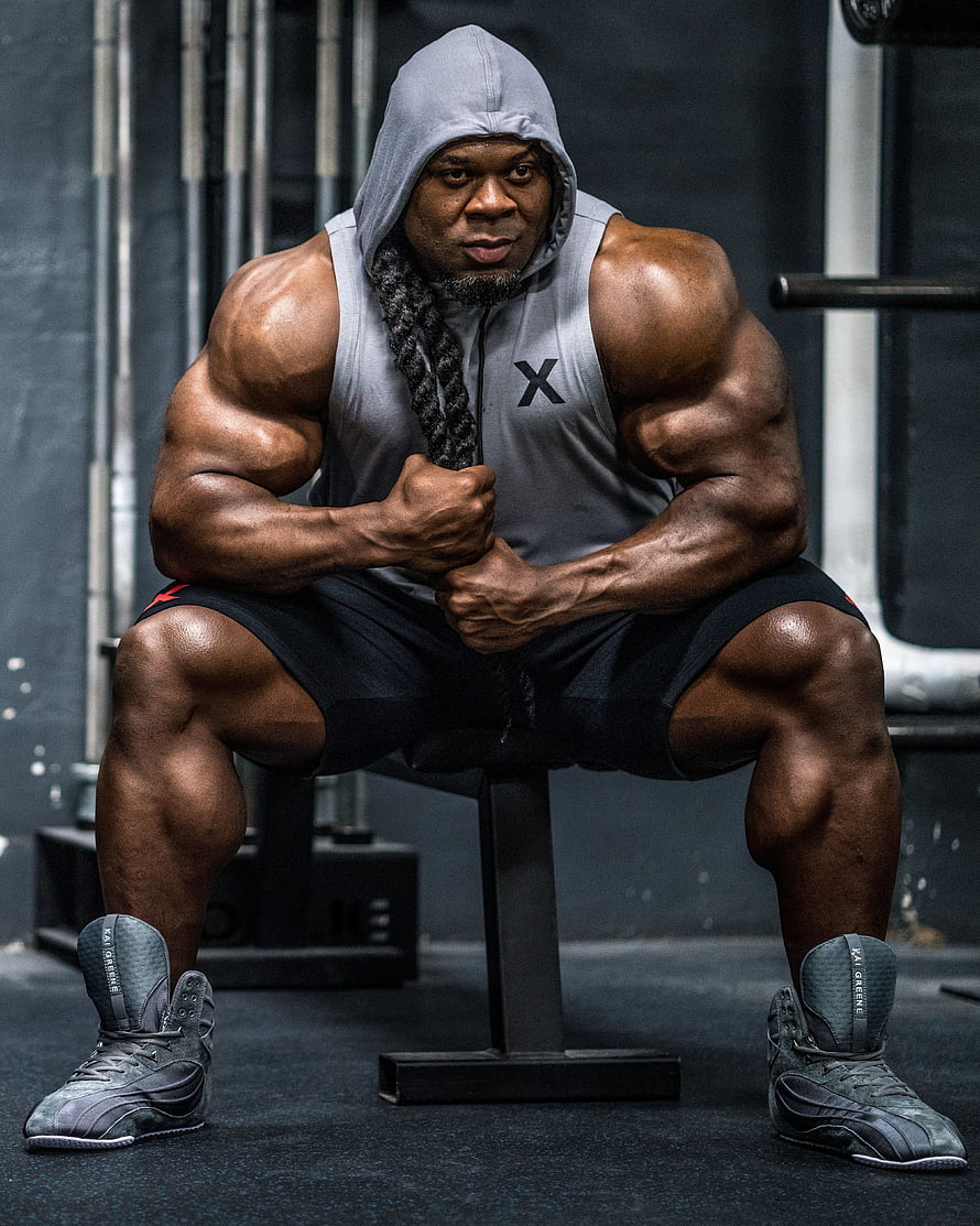 Kai Greene Bodybuilder Portrait in Gym Hoodie and Tank Top HD phone wallpaper