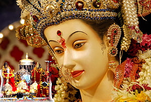 Ornate Goddess Vaishno Devi Idol Adorned With Jewels And Floral Garlands HD wallpaper