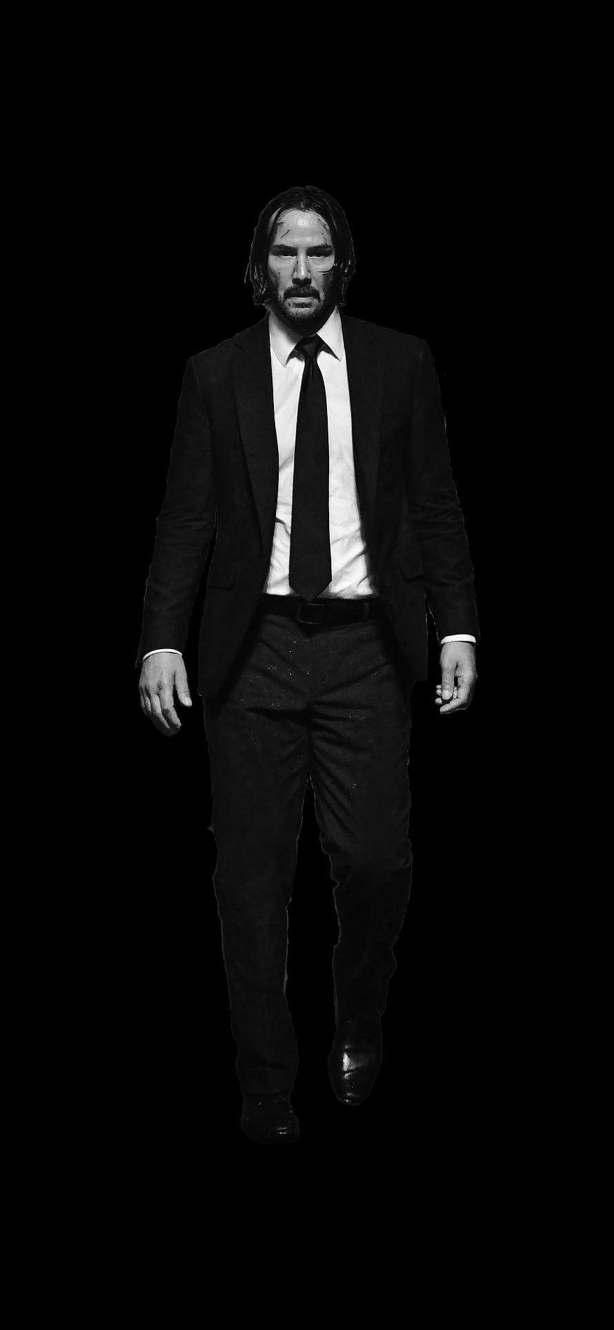 John Wick in a black suit walking forward against a dark background in monochrome HD phone wallpaper