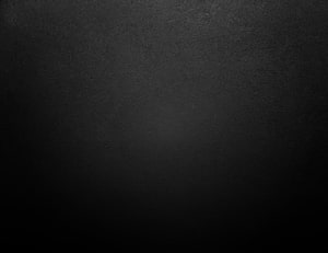 Dark Charcoal Gradient Texture with Subtle Grain and Vignette for Minimalist Design HD wallpaper