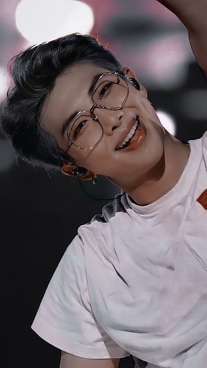 RM BTS smiling on stage wearing glasses and white t-shirt HD phone wallpaper