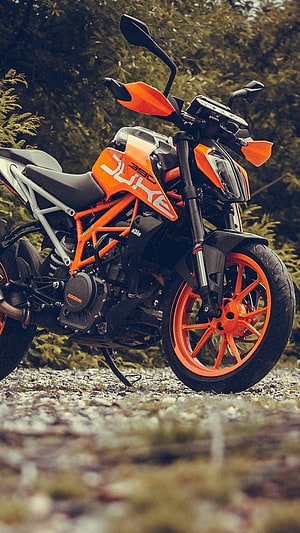 KTM 390 Duke Orange Naked Motorcycle Parked on Gravel Trail HD phone wallpaper