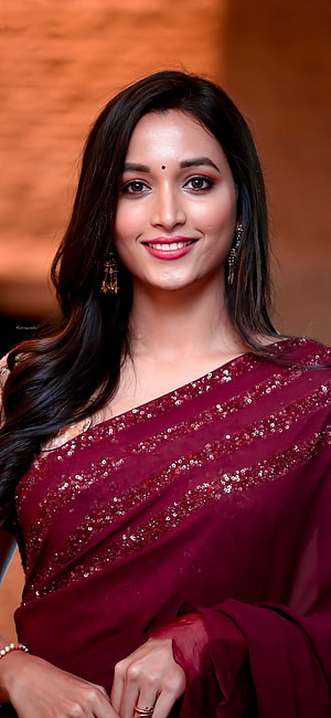 Srinidhi Shetty in a Sequined Maroon Saree with Traditional Jewelry HD phone wallpaper