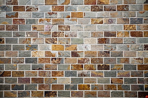 Rustic Multi-Tone Stone Brick Wall Texture with Natural Earthy Tones HD wallpaper