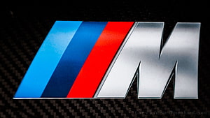 BMW M Performance Logo on Carbon Fiber Surface HD wallpaper
