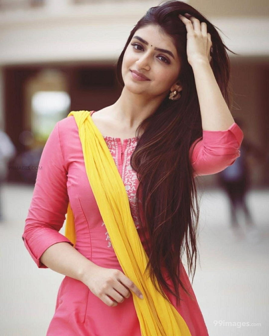 Sree Leela in a pink kurta with a yellow dupatta and long dark hair HD phone wallpaper
