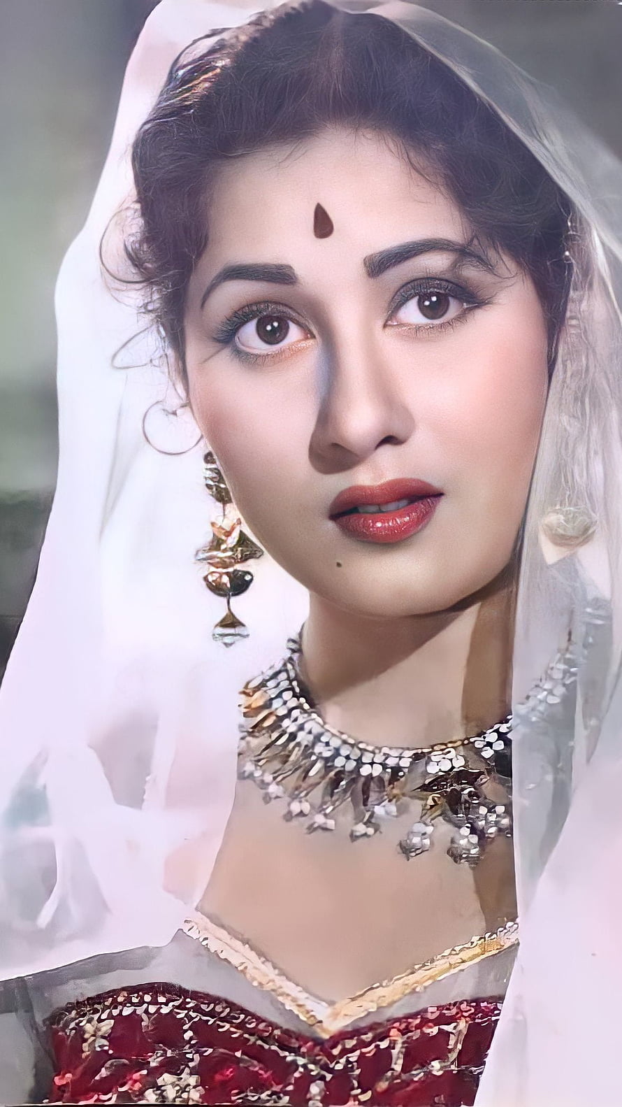 Madhubala vintage Bollywood portrait in traditional bridal attire with ornate jewelry and white veil HD phone wallpaper