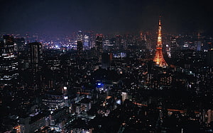 Tokyo Night Skyline Featuring the Illuminated Tokyo Tower and Dense Urban Lights HD wallpaper