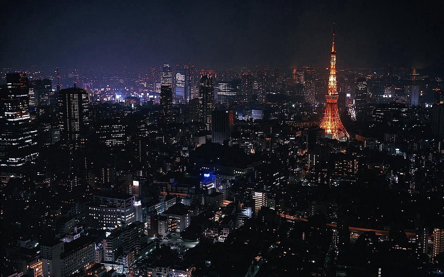 Tokyo Night Skyline Featuring the Illuminated Tokyo Tower and Dense Urban Lights HD wallpaper